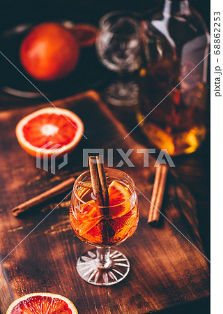 Glass of orange whiskey sour cocktail 68862253