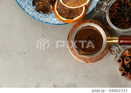 Copper turk with coffee and dried fruit pieces on table Copper turk with coffee and dried fruit pieces on table 68862355