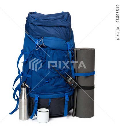 Blue hiking backpack with fitness mat isolated on white 68863310