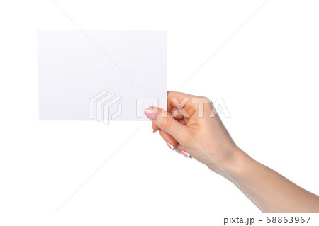 Woman's hand holding blank white sheet of paper isolated on white 68863967
