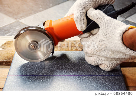 Cut the tiles with an electric grinder. Cut the tiles with an electric grinder. 68864480