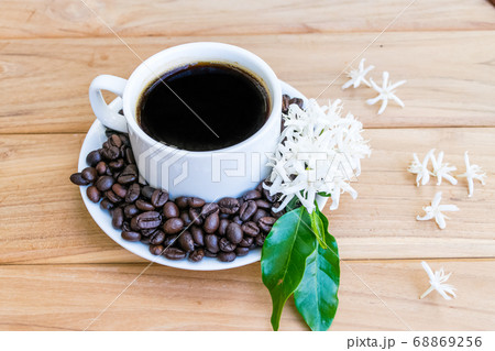 Coffee cup with coffee beans 68869256