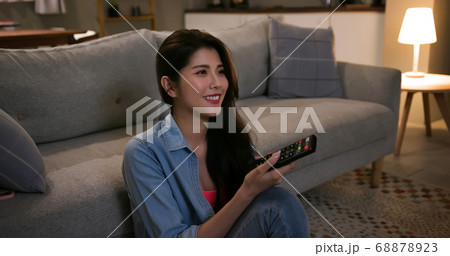 woman watch tv at home 68878923