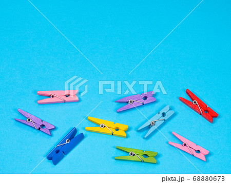 Colored clothespins or clothes peg collection on blue background 68880673