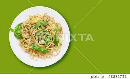 Fettuccine pasta with pesto sauce and basil Fettuccine pasta with pesto sauce and basil 68881731