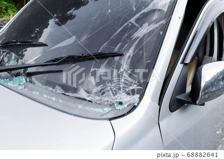 Broken white car because of the crash accident Broken white car because of the crash accident 68882641