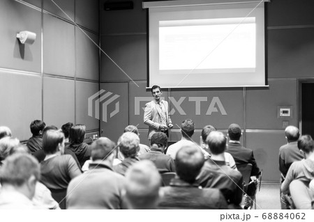 Business speaker giving a talk at business conference meeting event. Business speaker giving a talk at business conference meeting event. 68884062