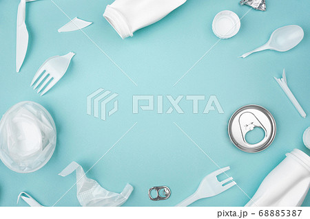 Plastic frame of white garbage with copy space on blue background, flay lay. 68885387