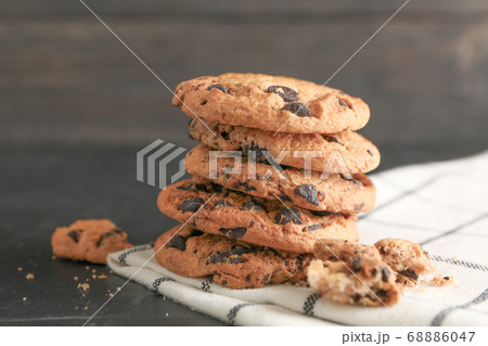Stack of tasty chocolate chip cookies on napkin Stack of tasty chocolate chip cookies on napkin 68886047
