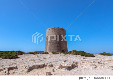 View of the old observation tower Torre De Ses Portes on the coast of the Ibiza island. 68886414