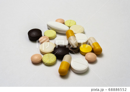 Colorful pills and capsules on a white background Colorful pills and capsules on a white background 68886552
