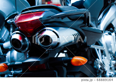 Motorcycle pair exhaust pipes close-up 68889164