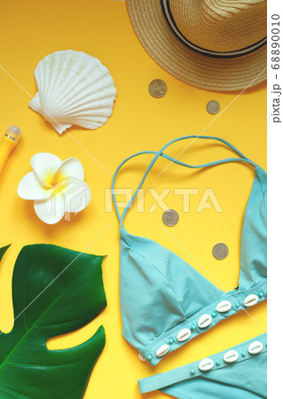 set of summer beach accessories on a yellow 68890010