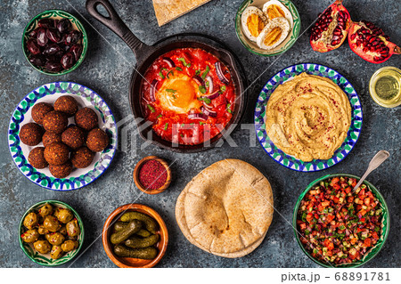 Falafel, hummus, shakshuka, Israeli salad  68891781