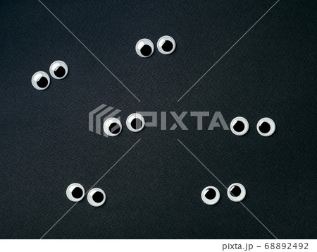 googly eyes on black background, copy space googly eyes on black background, copy space 68892492