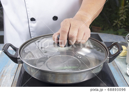 Chef prepared water to pot for make mashed 68893096