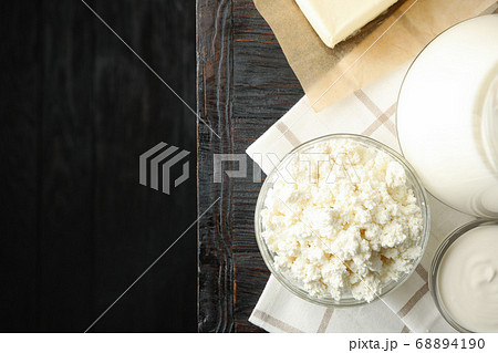 Fresh dairy products and towel on wooden Fresh dairy products and towel on wooden 68894190