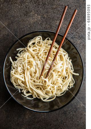 Cooked udon noodles. Traditional Japanese noodles. Cooked udon noodles. Traditional Japanese noodles. 68895093