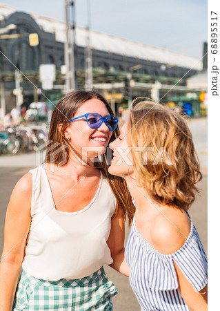 Happy girlfriends hugging and saying hi to each Happy girlfriends hugging and saying hi to each 68895517