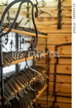 A shop or a museum of blacksmithing.The key hung on the wall. The forged curl. 68896119