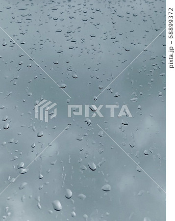 Water droplets on the glass with a background 68899372