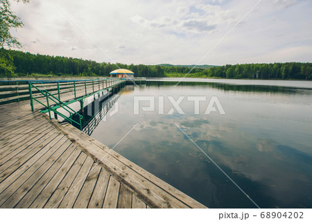 fishing bridge by the river. boat landing on the lake. water and transport 68904202