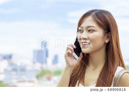 Business woman making a phone call Business woman making a phone call 68906818