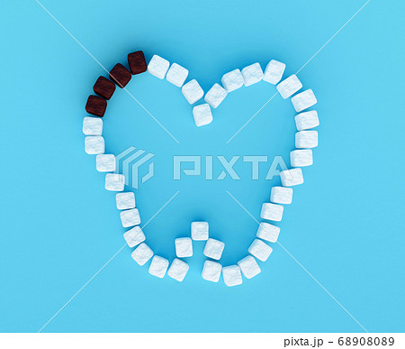 Tooth from sugar cubes on blue background, some 68908089