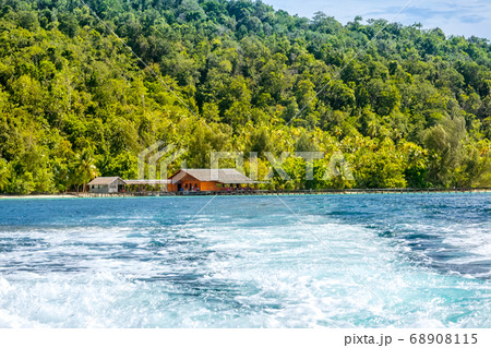 Water Foam Astern When Sailing From a Tropical Island with Hut 68908115