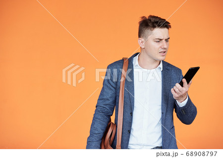 Businessman reading shocking message 68908797