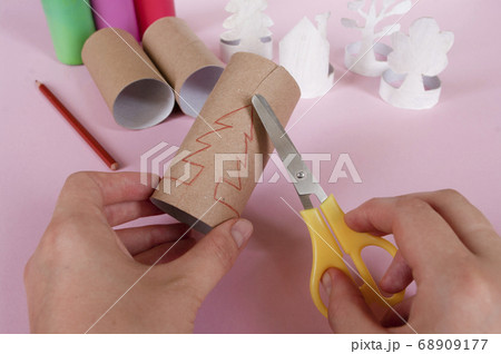 How to make trees, decoration. Daily activities, diy for kids, zero waste, eco toys hand made from paper roll. 3 step take scissors. How to make trees, decoration. Daily activities, diy for kids, zero waste, eco toys hand made from paper roll. 3 step take scissors. 68909177
