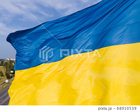 National flag of Ukraine by day. Kyiv aerial 68910539