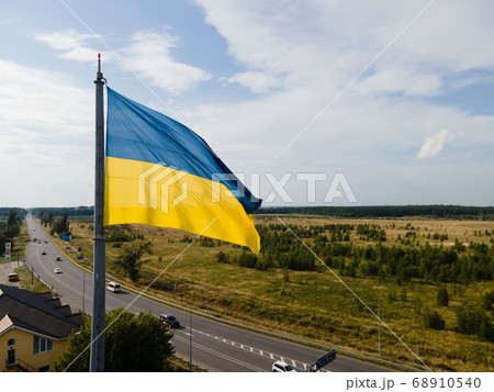 National flag of Ukraine by day. Kyiv aerial 68910540