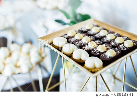 Delicious wedding reception candy bar dessert table Delicious wedding reception candy bar dessert table 68913341