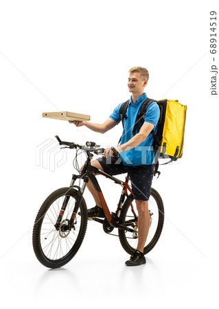 Deliveryman isolated on white studio background. Contacless delivery service during quarantine. Deliveryman isolated on white studio background. Contacless delivery service during quarantine. 68914519