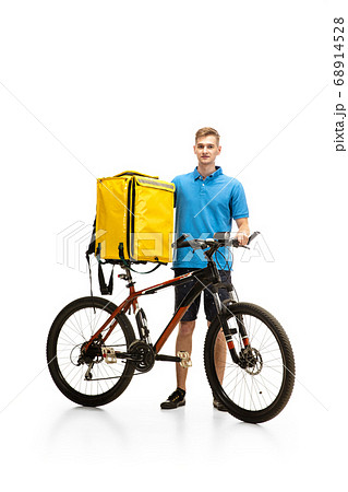 Deliveryman isolated on white studio background. Contacless delivery service during quarantine. 68914528
