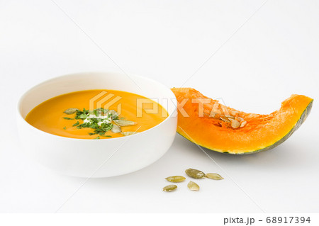 Pumpkin soup in bowl isolated on white background Pumpkin soup in bowl isolated on white background 68917394