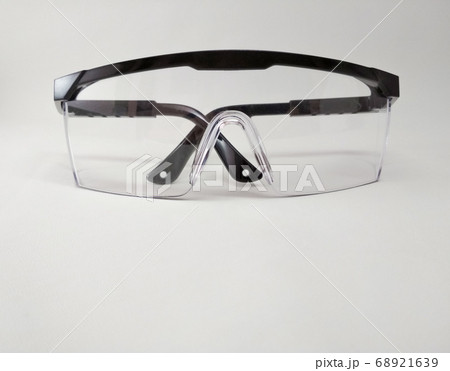 Protective Goggles or Safety Glasses. eye protection, infection. pandemic Covid-19	 68921639