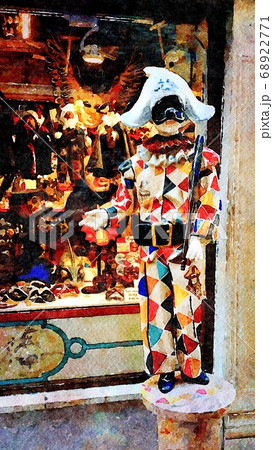 the statue of Harlequin and the carnival masks in a small street in the historic center of Venice 68922771