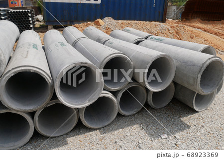 KUALA LUMPUR, MALAYSIA -MAY 13, 2020: Concrete culvert at construction site. The material is shipped by the manufacturer and is ready for installation. Made of reinforced concrete KUALA LUMPUR, MALAYSIA -MAY 13, 2020: Concrete culvert at construction site. The material is shipped by the manufacturer and is ready for installation. Made of reinforced concrete 68923369