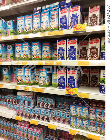 SEREMBAN, MALAYSIA -JULY 5, 2019: Processed and fresh milk packed in the paper box and displayed on the rack inside the supermarkets.  Sorted by brand and type for easy for the customer to choose.  68924267
