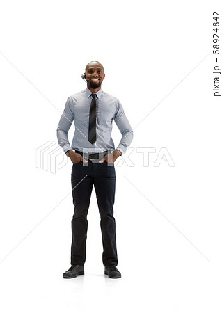 Young african-american call center consultant with headset isolated on white studio background 68924842