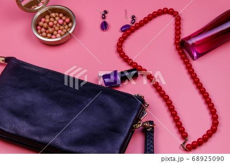 Clutch bag, red necklace, earrings, nail polish 68925090