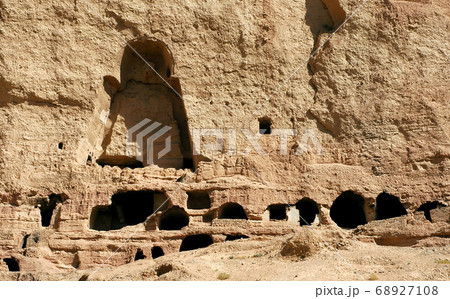Caves in the cliffs near Bamyan (Bamiyan), Afghanistan. Local Afghan people still live in the caves. The caves are in cliffs where the Bamyan (Bamiyan) Buddhas used to stand. UNESCO site Afghanistan. 68927108