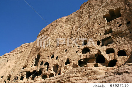 Caves in the cliffs near Bamyan (Bamiyan), Afghanistan. Local Afghan people still live in the caves. The caves are in cliffs where the Bamyan (Bamiyan) Buddhas used to stand. UNESCO site Afghanistan. Caves in the cliffs near Bamyan (Bamiyan), Afghanistan. Local Afghan people still live in the caves. The caves are in cliffs where the Bamyan (Bamiyan) Buddhas used to stand. UNESCO site Afghanistan. 68927110