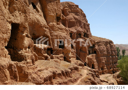 Caves in the cliffs near Bamyan (Bamiyan), Afghanistan. Local Afghan people still live in the caves. The caves are in cliffs where the Bamyan (Bamiyan) Buddhas used to stand. UNESCO site Afghanistan. Caves in the cliffs near Bamyan (Bamiyan), Afghanistan. Local Afghan people still live in the caves. The caves are in cliffs where the Bamyan (Bamiyan) Buddhas used to stand. UNESCO site Afghanistan. 68927114