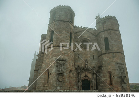 Gothic Cathedral with steeples in the morning mist 68928146
