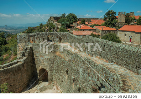 Pathway on stone wall with the front gate of Castle 68928368