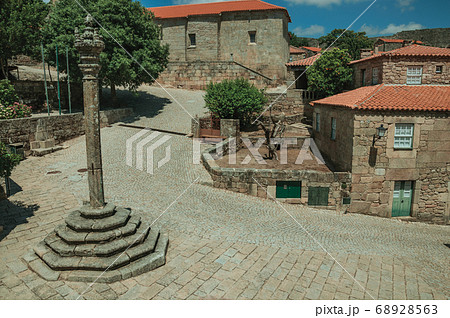 Stone houses and chapel encircling a square Stone houses and chapel encircling a square 68928563