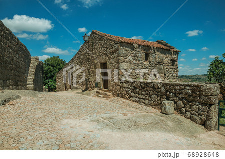 House made of stone on deserted alley 68928648